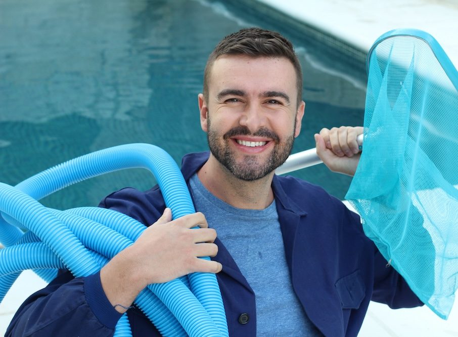 Employee of swimming pool cleaning service.